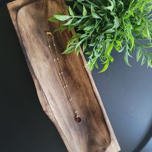 Ruby and gold necklace with pearl detail